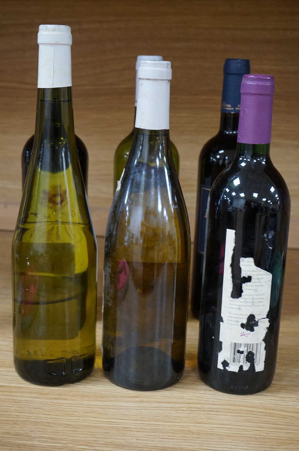 Six bottles of red and white wine to include Chablis Premier Cru 2001, Domaine Du Parc Muscadet 2003, Vin De Bordeaux, Chateau Lafite Monteil Bordeaux Supérieur 2020, Moncade Bordeaux and Buzet 1996. Condition - fair